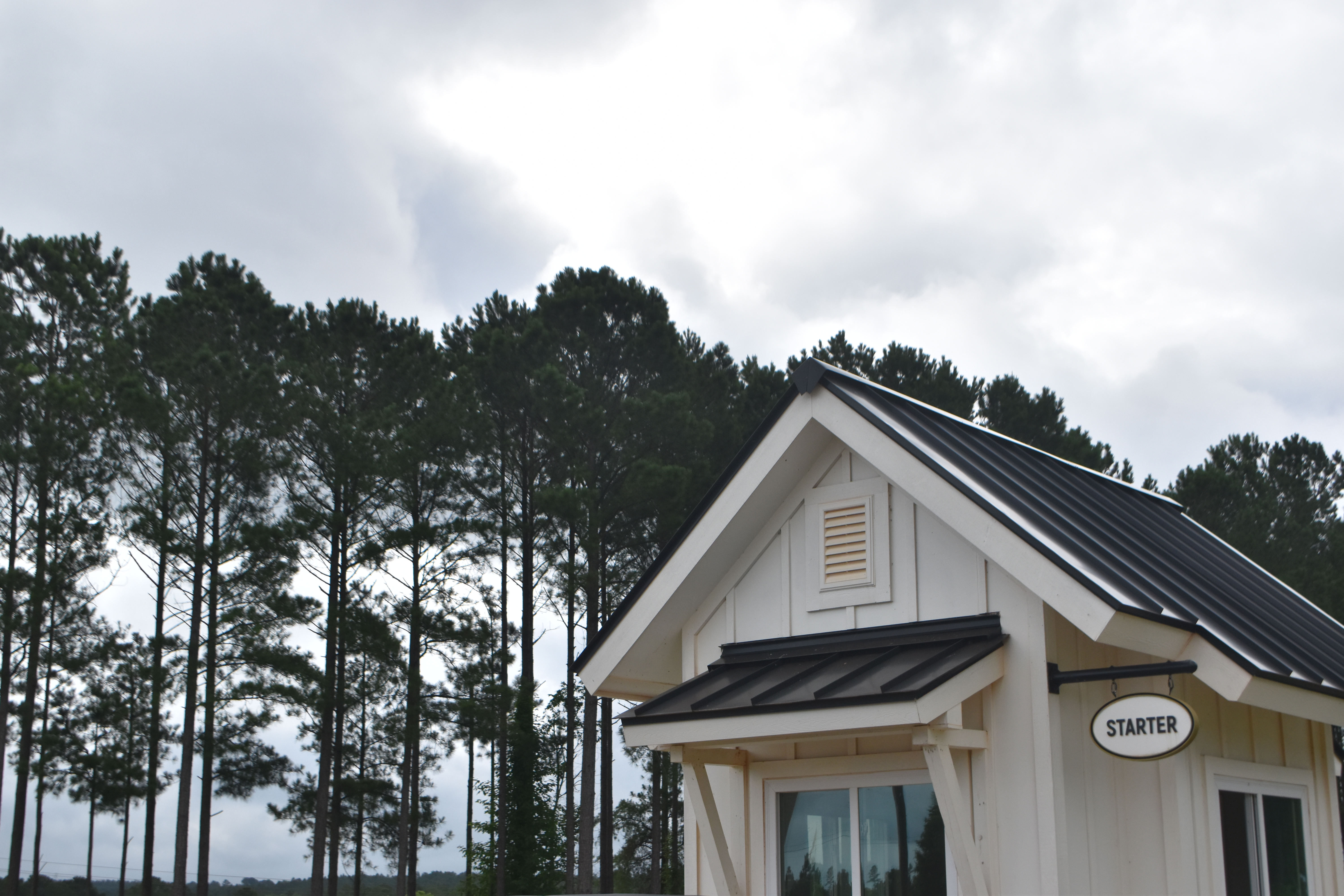 Clubhouse with trees lining the background